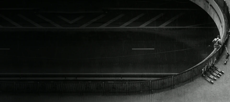 people walking in an intersection as the rain is falling