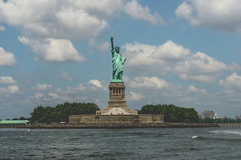a statue of liberty on top of a small island