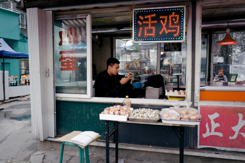 a man standing in front of a market