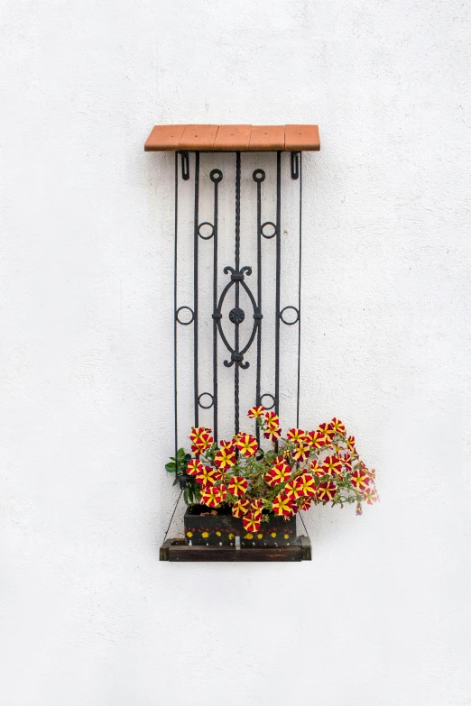 a balcony with a fence and flowerpots on the windowsill