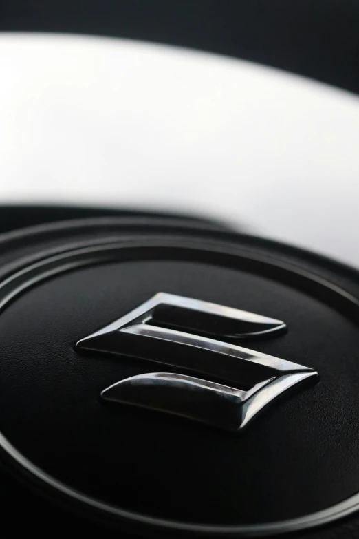 a black and white image of the emblem of a new car