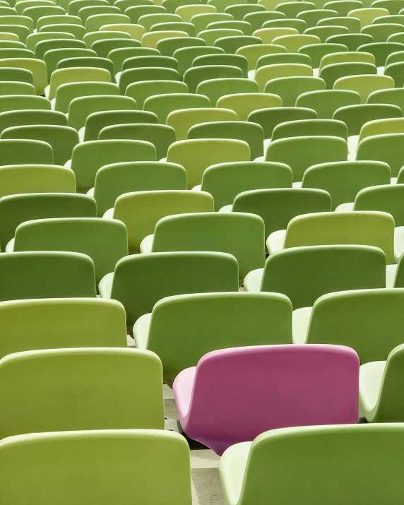 green seats with purple chairs in the middle