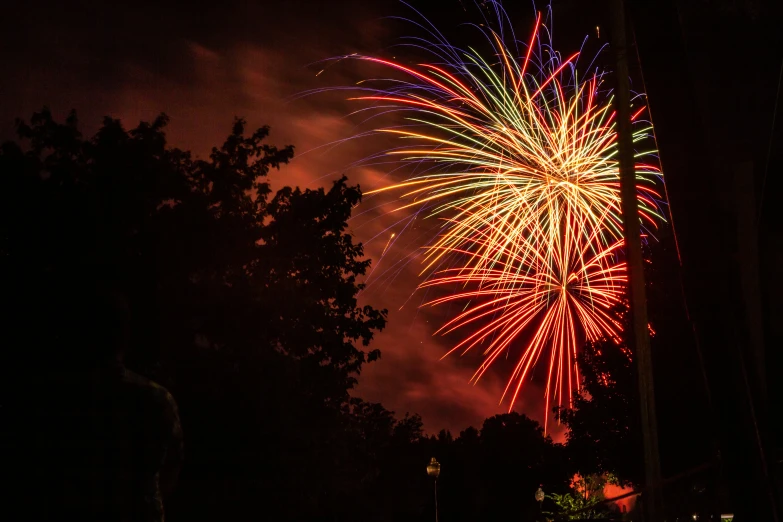 a huge bright fireworks bursting out of a dark sky