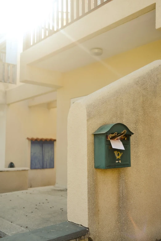 a green box on the side of a building