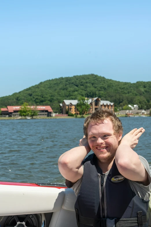 a man that is sitting on a boat