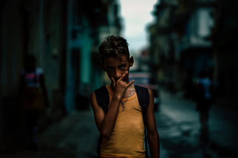  standing on the street smoking cigarette