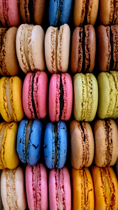 a bunch of macaroons that are on a rack