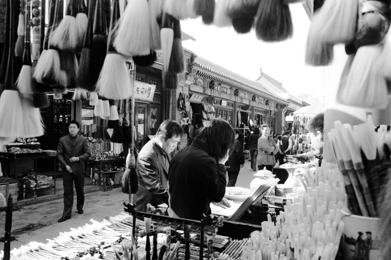 people shopping in an asian flea market