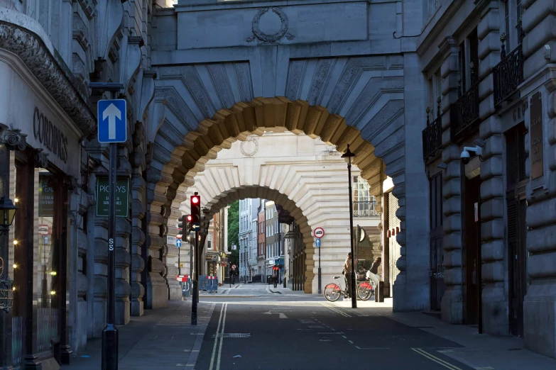 a tunnel in the street that is very large and stone