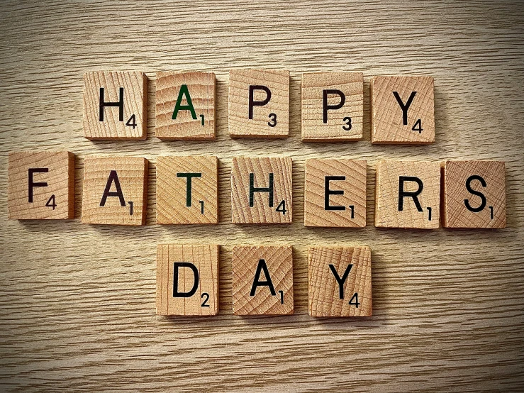 wooden blocks with words that spell happy fathers day