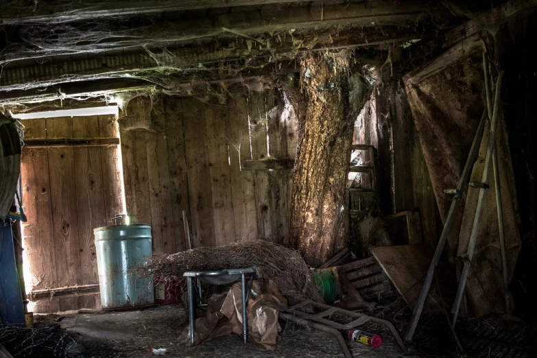 a room with dirt and hay strewn around it