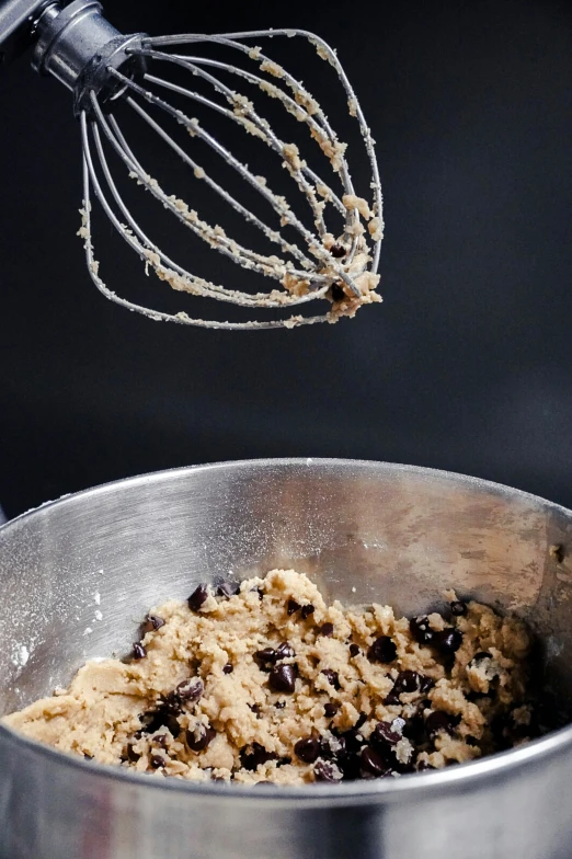 a bowl full of food is being whisked