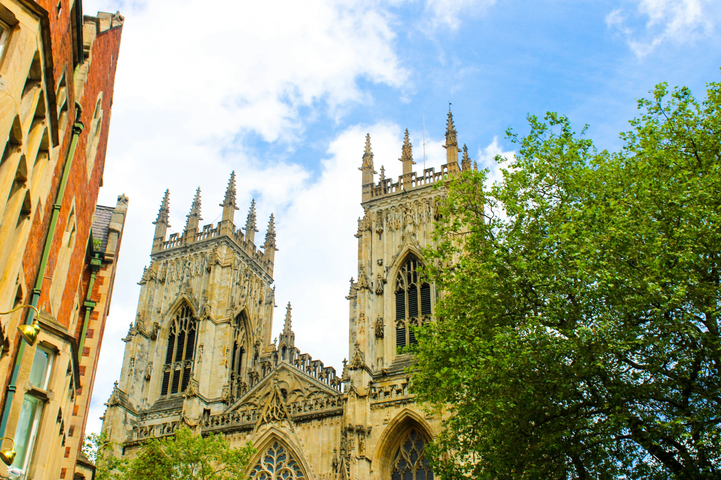 the cathedral is tall with several spires in the old city