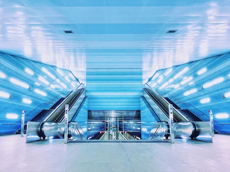 two escalators next to each other in an airport