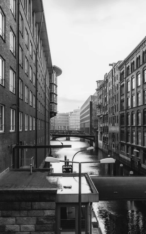 an area with water, buildings and a fence