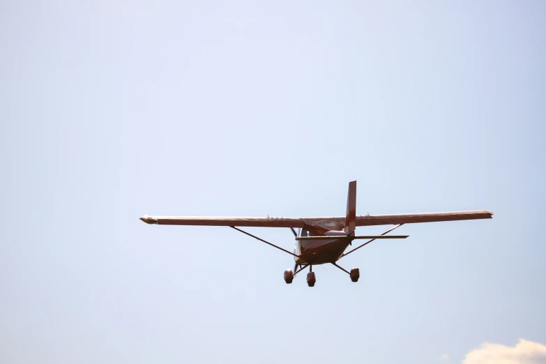 a small, single engine plane taking off into the air