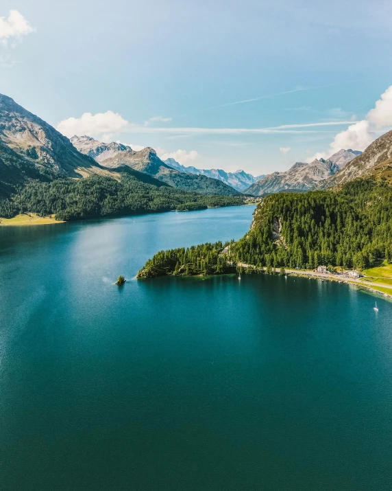 a beautiful blue body of water surrounded by a mountain range