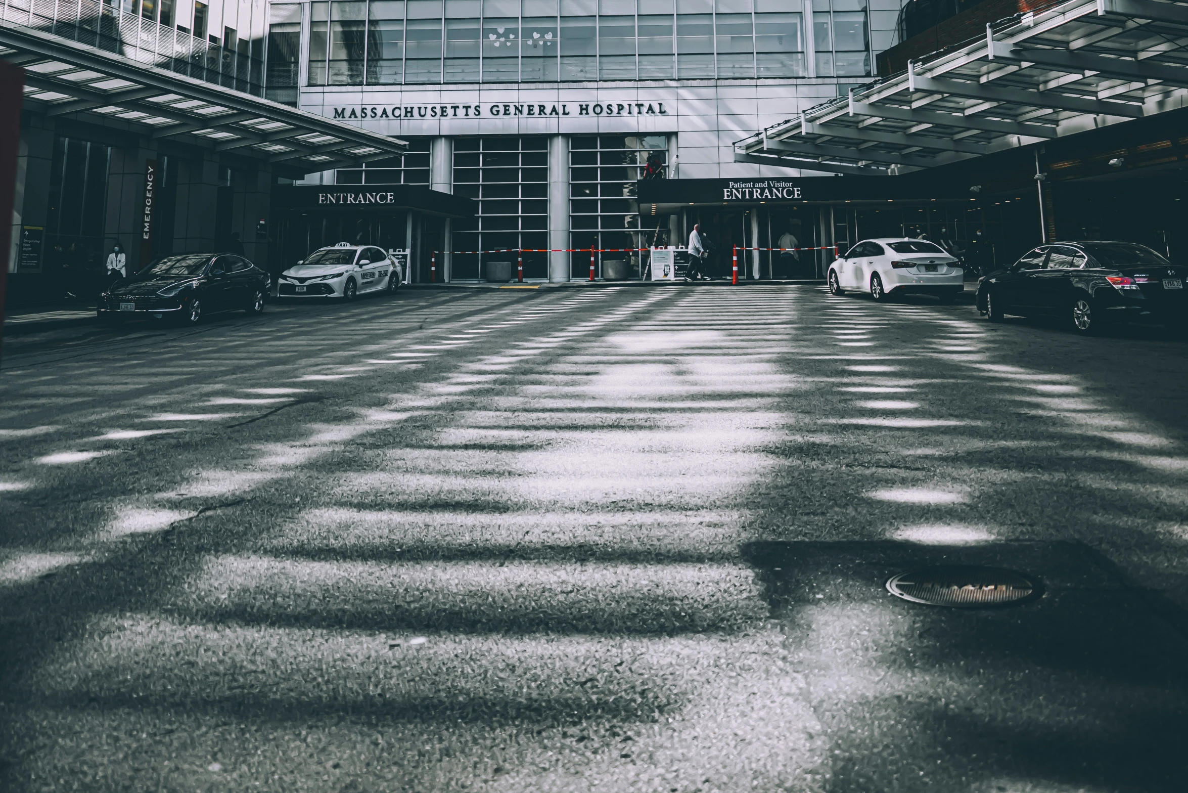 a empty parking garage with a large building in the background