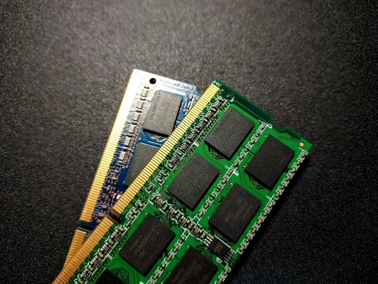 two memory ram cards sitting side by side