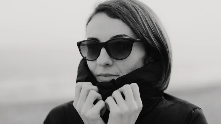 black and white pograph of a woman in sunglasses