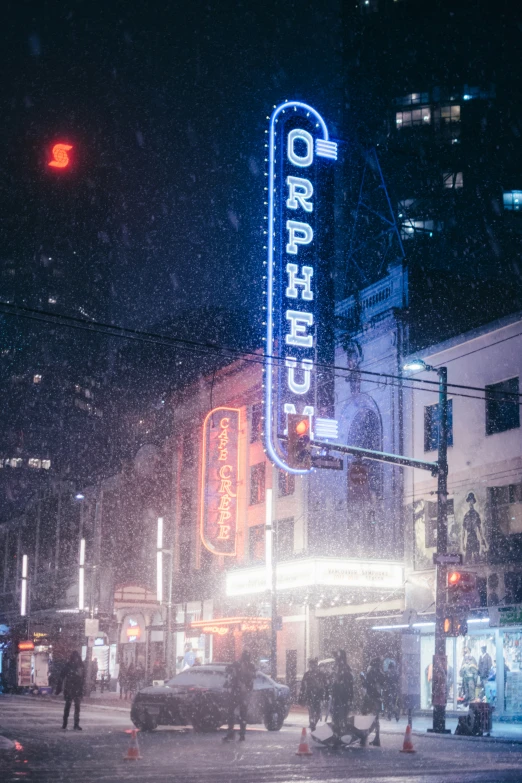 a po of a night scene of a street intersection