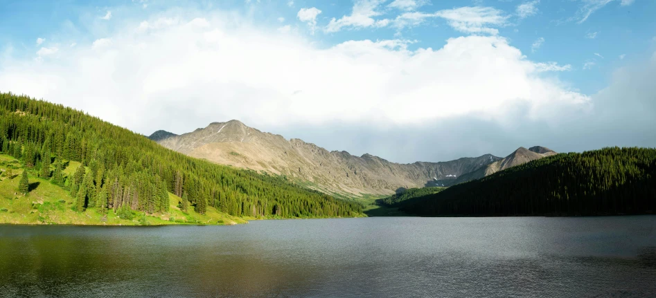 a lake and mountains are in the distance