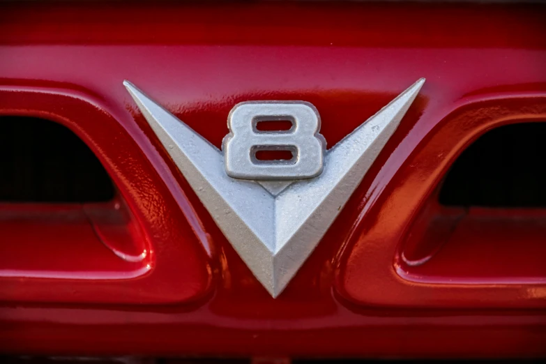 a close up of the badge on a classic car