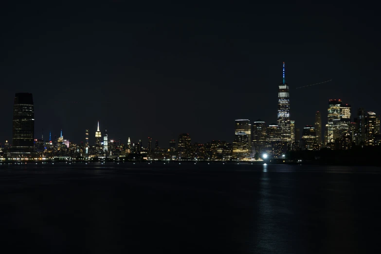 a skyline view from the water at night