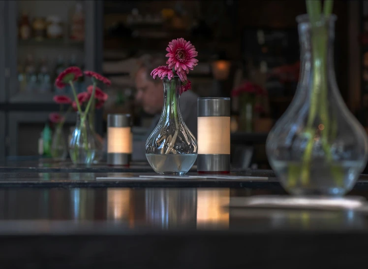 a bunch of vases that are sitting on the table