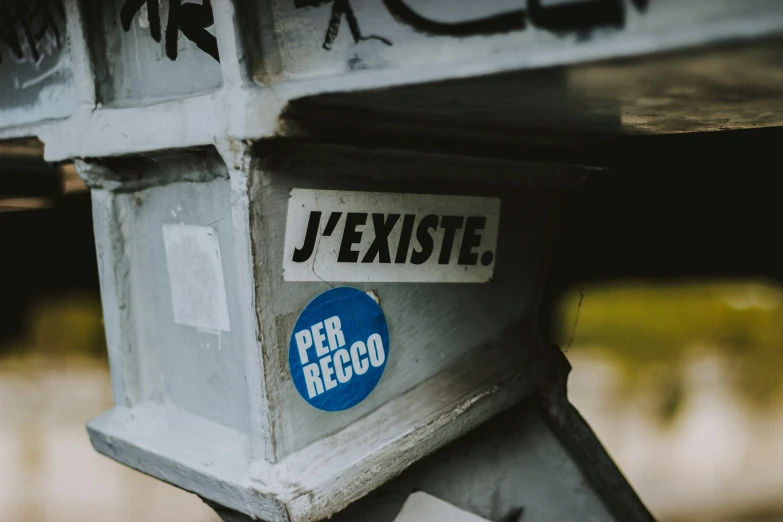 the top of a mailbox with some writing on it