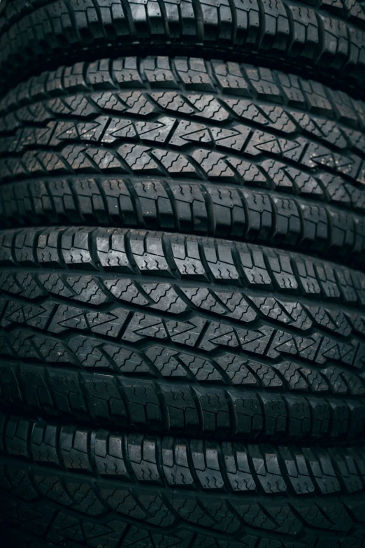 a pile of new tires that are stacked together