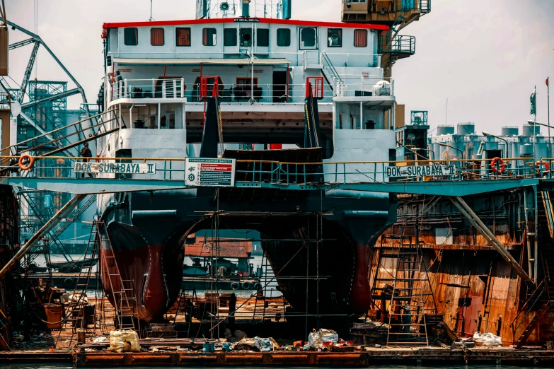 there is a large ship at the pier in the water