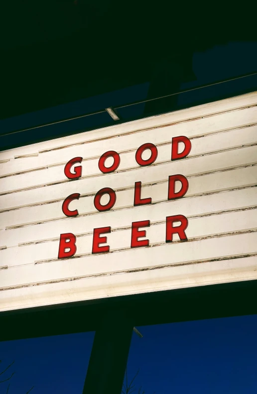 the sign for a bar that says good cold beer