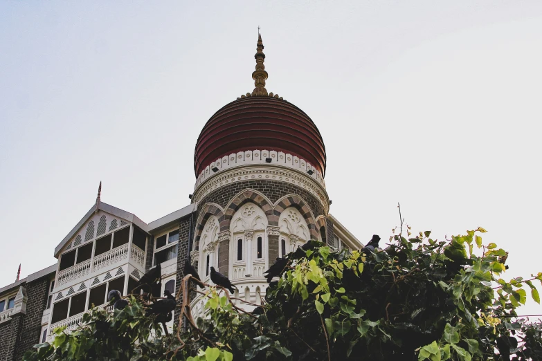 an old building with a domed roof and a red dome