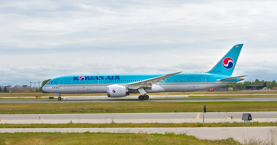 a korean air plane is on the runway