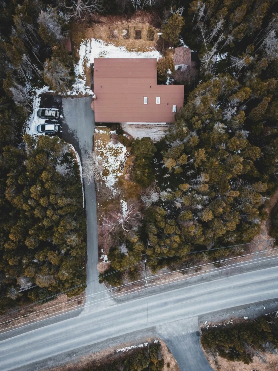 an aerial view of some houses in a wooded area