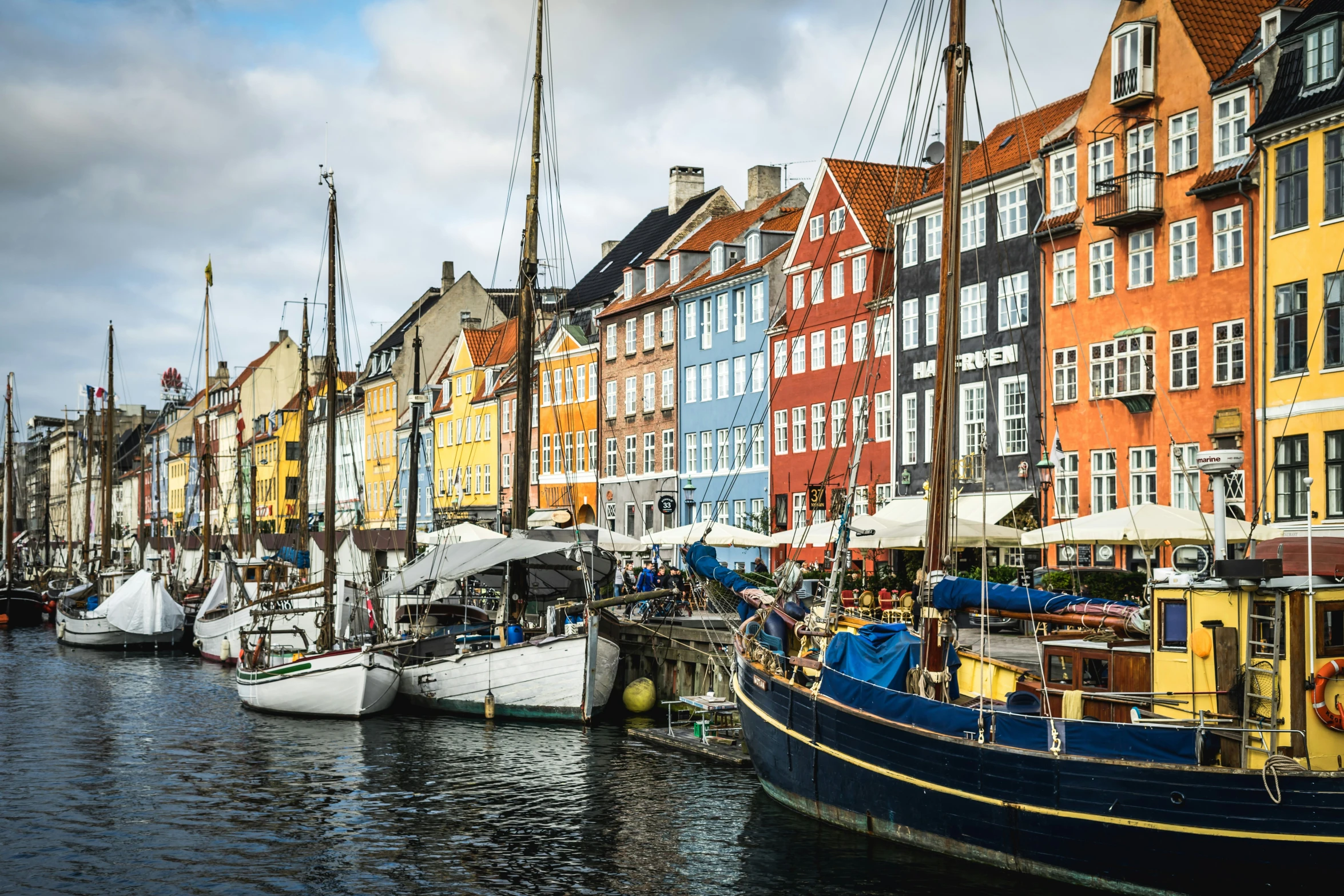 many different colored buildings sitting along side each other