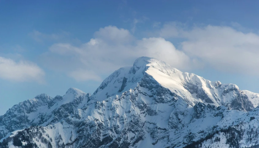 a huge mountain peak with snow on it