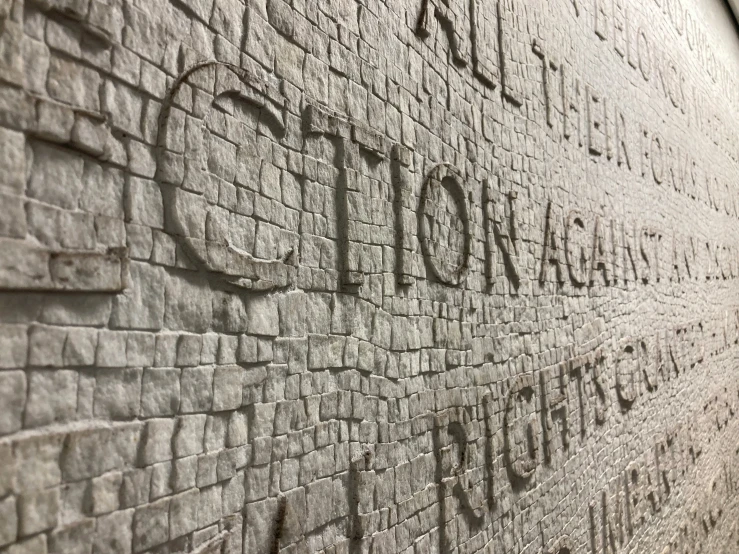 a stone wall with a sign reading the city of york