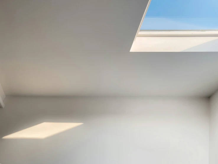 this room has a skylight and no curtains in it