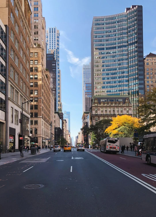 a long stretch of road with cars and buildings