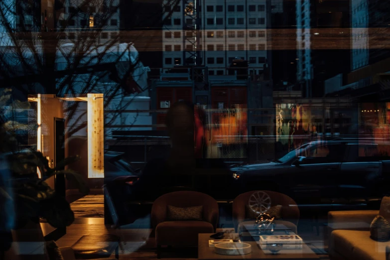 a dark building filled with couches and chairs