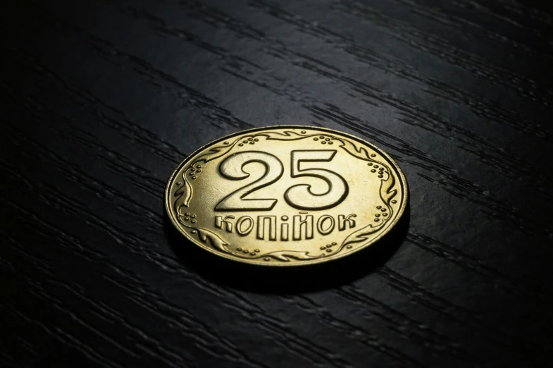 an 25 cent coin that says,'the twenty dollars '