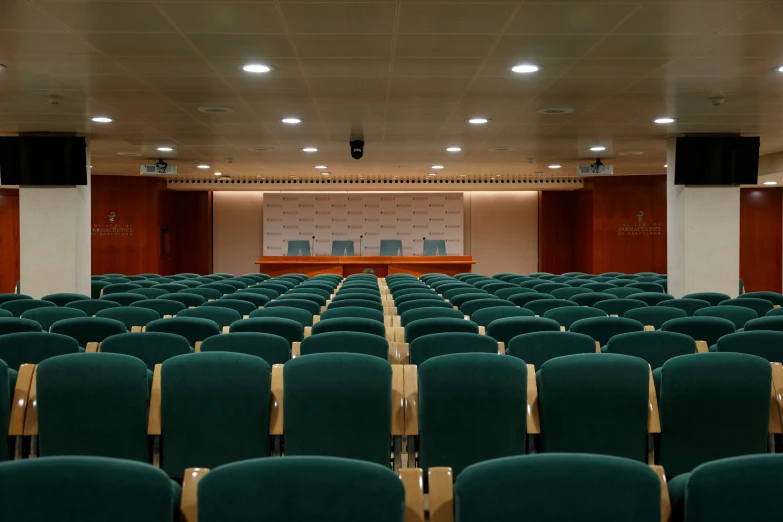 auditorium in el setting filled with many rows