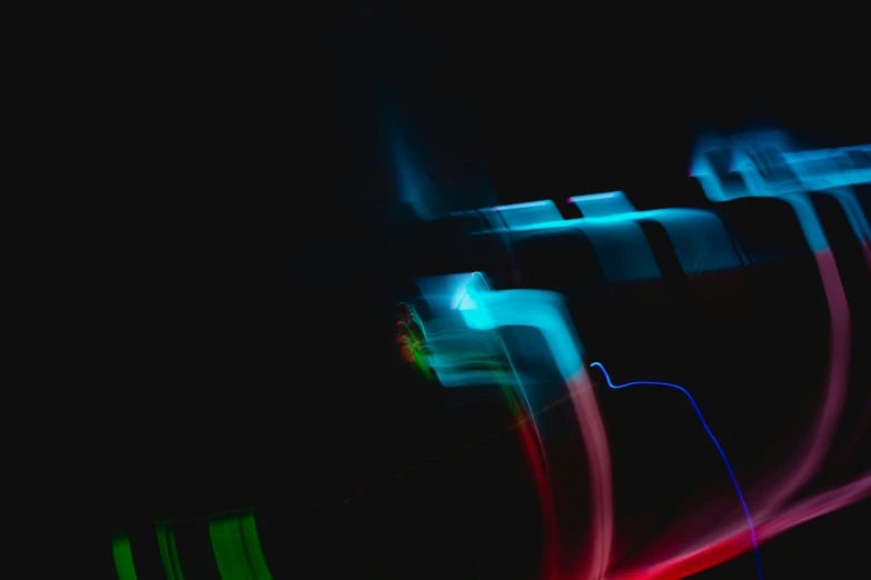 colorful streaks of neon light on a black background