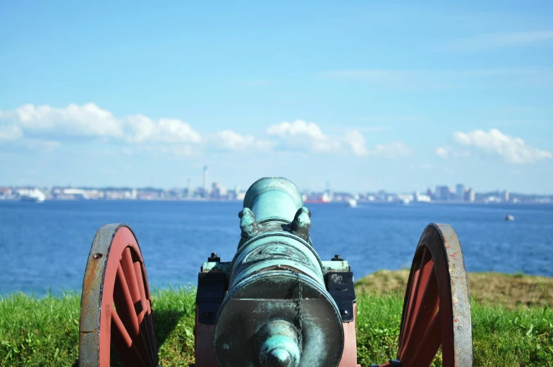 the view of a cannon near the water