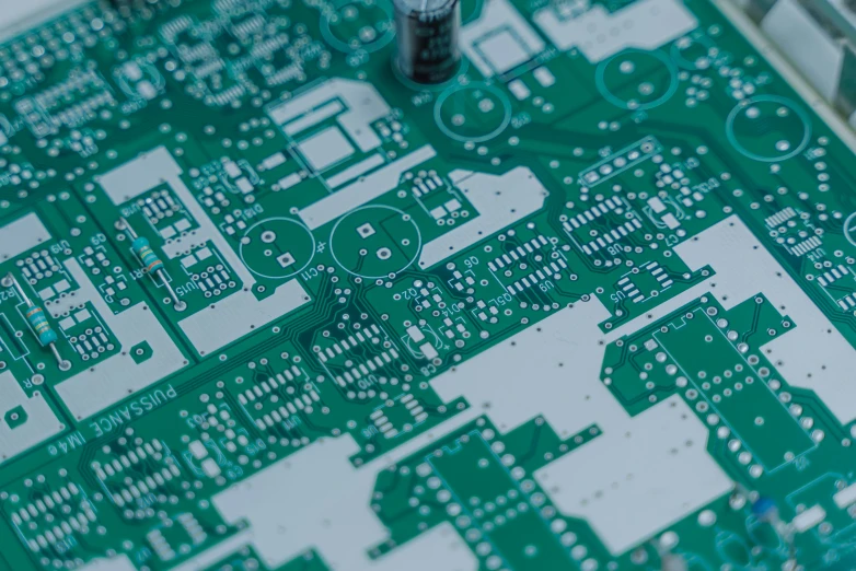 the top of a green and white electronic board