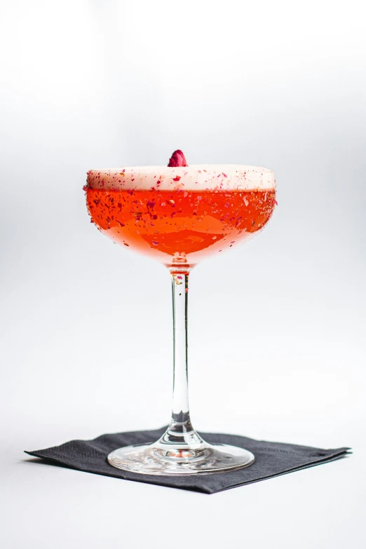 a close up of a wine glass on a table