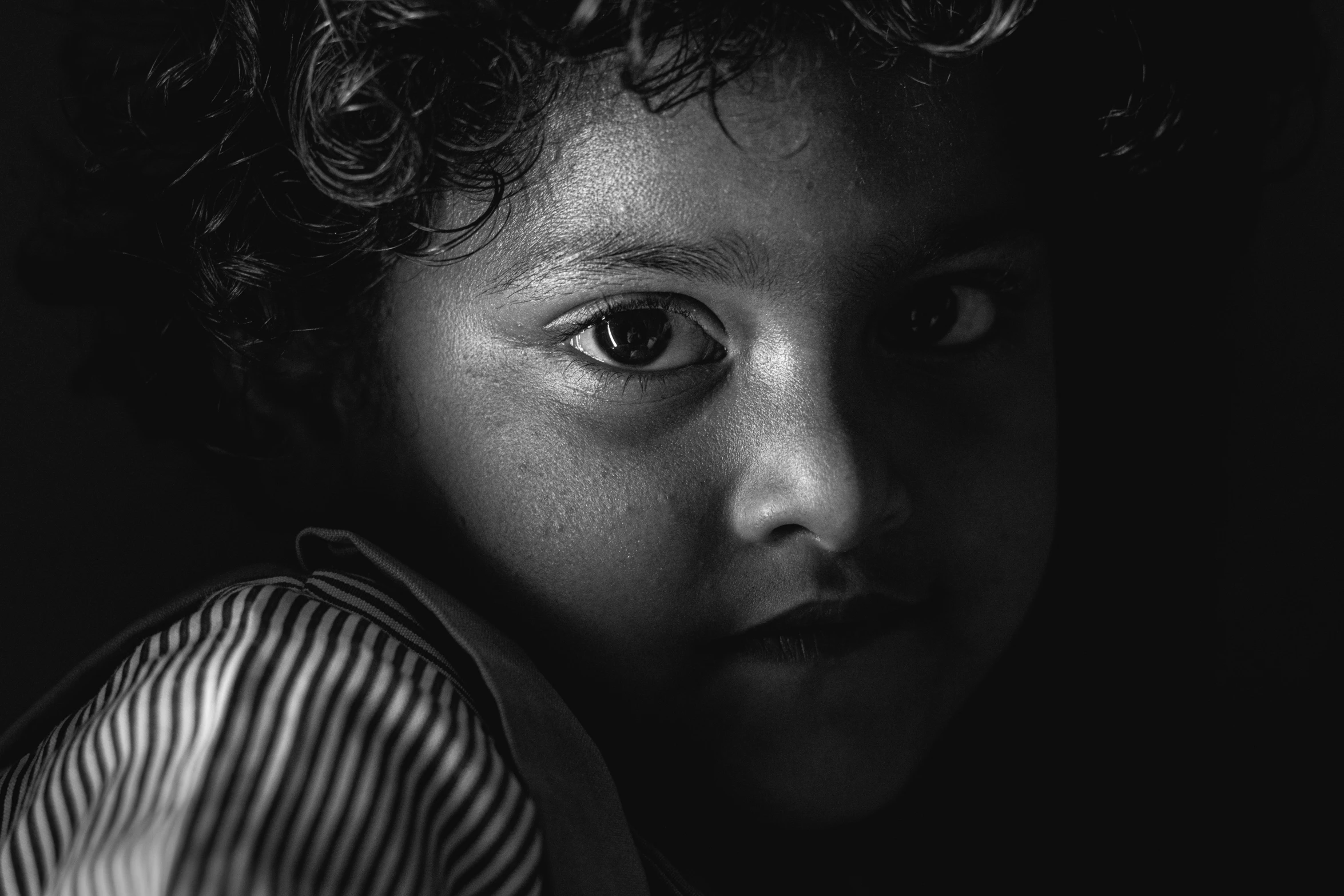 a black and white po of a young child