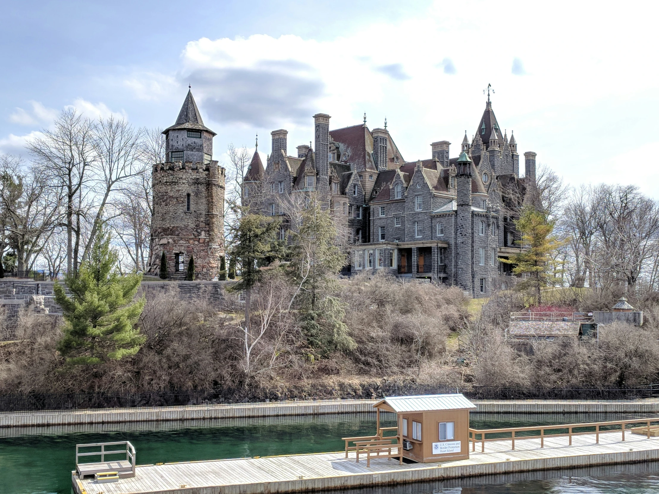 a body of water with a building in the back